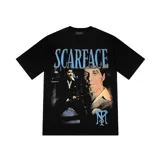 Camiseta negra de manga corta con estampado frontal de la película Scarface, con Tony Montana y el logo de Trapstar.