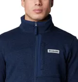 Polar Columbia de hombre, color azul marino jaspeado, con cierre frontal completo, cuello alto y bolsillos laterales con cierre. Presenta un bolsillo superior en el pecho con cierre y un parche con el logo de Columbia.