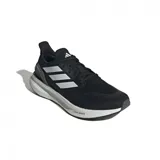 Zapatillas de running color negro con detalles en blanco, diseño ligero y suela de amortiguación.