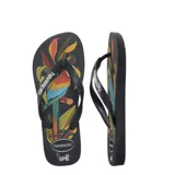 Sandalias Havaianas modelo Ipe, con base negra y estampado de hojas de colores.