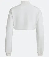 Buzo cropped blanco de algodón con cuello alto y puños acanalados.