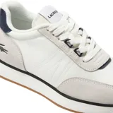 Championes Lacoste modelo L-Spin, color blanco con detalles en gris y azul marino.