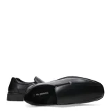 Zapato de vestir negro de cuero, sin cordones y con elásticos laterales.