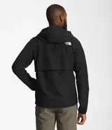 Campera negra con capucha, resistente al viento, con cierre frontal y bolsillos laterales. Logotipo de The North Face estampado en blanco en el pecho y en la espalda.