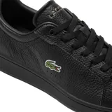 Championes urbanos de cuero negro con logo de cocodrilo verde bordado en el lateral.