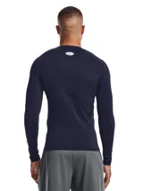Remera de compresión Under Armour HeatGear de manga larga, color negro con logo blanco en el pecho.