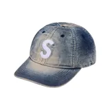 Gorra de béisbol Supreme modelo Cordura Denim S Logo, color azul denim con logo "S" bordado en blanco en el frente.