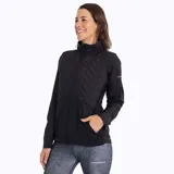 Buzo celeste con cuello alto, cierre de cremallera, elástico ajustable en la cintura y bolsillos laterales.