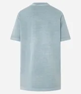 Remera de algodón con efecto desteñido, color verde azulado, corte holgado y cuello redondo. Presenta un estampado frontal en color rosado con el texto "Athleti 1998" y una línea horizontal.