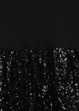 Minivestido negro con cuerpo ajustado sin mangas y falda globo cubierta de lentejuelas.