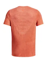 Remera deportiva gris jaspeado de corte clásico, con cuello redondo y mangas cortas. Confeccionada con tejido de punto transpirable y tecnología seamless para mayor comodidad.