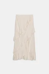 Falda midi color crudo de tiro medio con volantes en cascada y cierre lateral con cremallera oculta.