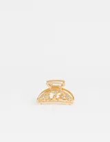 Broche dorado para el pelo con forma de media luna y apliques de strass.