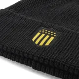 Gorro de lana negro con escudo del Club Atlético Peñarol bordado en amarillo y logo de Puma bordado en amarillo.