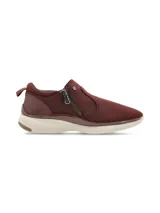 Zapatillas de mujer color bordó, sin cordones, con cierre lateral de cremallera y suela blanca.