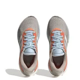 Championes Adidas Supernova 2 X color gris con detalles en naranja y celeste, con las tres tiras blancas características de la marca.