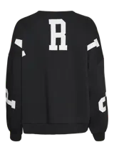 Sudadera negra de corte oversize con cuello redondo, hombros caídos y puños acanalados. Estampado frontal con la palabra "PARIS" en letras blancas y la frase "CITY OF DREAMS 1978" debajo.