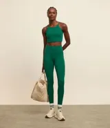 Calza legging deportiva color verde agua, de microfibra, con cintura ancha y bolsillos laterales.