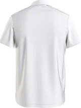 Chomba blanca de felpa de Tommy Hilfiger con cuello clásico, corte amplio, logo bordado en el pecho y detalles distintivos de la marca.