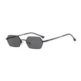 Lentes de sol unisex con montura metálica negra y lentes hexagonales grises con filtro UV400.