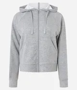 Campera deportiva verde esmeralda de modal, con capucha ajustable con cordón, cierre frontal con cremallera y bolsillos laterales.
