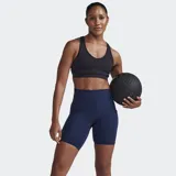 Short de ciclismo de compresión de tiro alto, color azul marino oscuro, con acabado mate y panel frontal liso. Presenta un bolsillo lateral grande para teléfono y otros artículos esenciales.