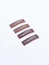 Set de cuatro broches para el cabello color marrón con forma rectangular.