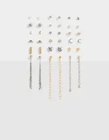 Set de 18 pares de aros con distintos diseños: perlas, strass, lunas, corazones, hojas y cadenas colgantes. El set incluye aros dorados y plateados.