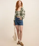 Blusa sin mangas color verde con estampado de cuadros argyle.