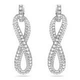 Aros colgantes Swarovski de la colección Hyperbola, con forma de símbolo de infinito, elaborados en metal con baño de rodio y cristales blancos engarzados. Cierre de clip.