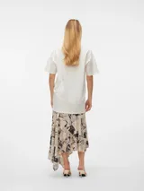 Remera blanca de algodón con estampado de las protagonistas de la película Clueless.