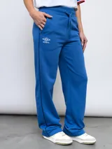 Pantalón de jogging azul con el escudo del Club Nacional de Football y el logo de Umbro.