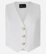 Chaleco color crudo confeccionado en sarga con botones delanteros de escudo y pences. Este producto posee algodón certificado BCI en su composición, siendo ambientalmente más sostenible.