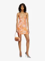 Vestido corto de algodón con estampado tie-dye en tonos verdes y azules. Tiene tirantes finos y escote en V.