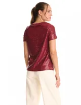 Blusa de lentejuelas color verde oscuro, marca Ninety, con escote a la base, manga corta y forro interno a tono.