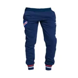 Pantalón de jogging azul marino con cintura elástica ajustable, bolsillos laterales con cierre y logo del Club Nacional de Football estampado en la pierna izquierda.