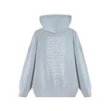 Buzo canguro negro con capucha, corte oversize y estampa frontal circular. La estampa presenta una imagen de la artista Tini Stoessel con el texto "FUTUTURA" en tipografía futurista sobre un fondo de rayos.