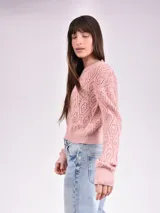Sweater de punto calado color crudo, de corte holgado y mangas largas.