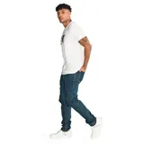 Pantalón de jean negro con efecto lavado, calce slim, cinco bolsillos y detalle de rotura en la rodilla.