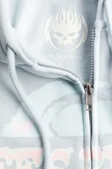 Campera celeste con capucha, cierre frontal y diseño estampado con el nombre de la banda The Offspring. De corte oversized con hombros caídos y puños y bajo acanalados.