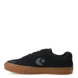 Championes urbanos Converse color negro, con logo lateral y suela de goma color caramelo.