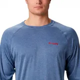 Remera de manga larga Columbia Terminal Tackle Heat, color gris jaspeado, con logo de la marca en el pecho y en la manga. Confeccionada en tejido transpirable de secado rápido y protección solar UPF 50.
