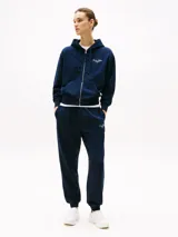 Buzo azul marino con capucha y cremallera frontal, con logo Tommy Hilfiger bordado en el pecho y en el puño.