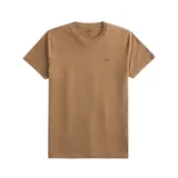 Remera color marrón claro de corte suelto, cuello redondo y mangas cortas. Tiene el logo de la marca bordado en el lado izquierdo del pecho.