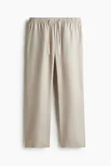 Pantalón color beige de lyocell, corte recto, con cintura elastizada y cordón ajustable.