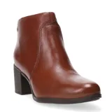 Botas de mujer de caña baja y puntera redonda, color marrón, con diseño elegante y cierre lateral.