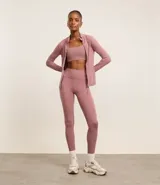 Calza legging deportiva color verde agua, de microfibra, con cintura ancha y bolsillos laterales.