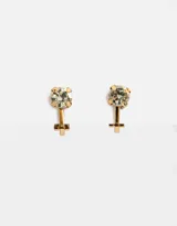 Par de aros dorados con forma del símbolo de venus, con strass incrustado.