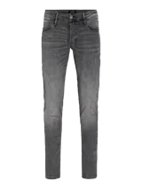 Jean gris de corte slim fit, tiro bajo, rodilla ajustada y pierna ceñida.