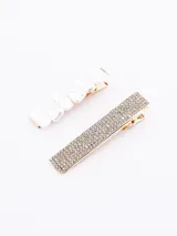 Set de dos broches para el pelo: uno rectangular con strass y otro rectangular con perlas.